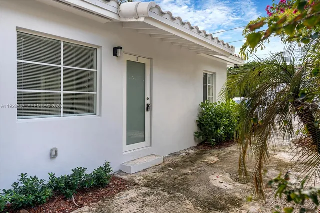 a house with a tree in front of it