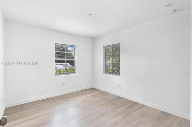 an empty room with windows