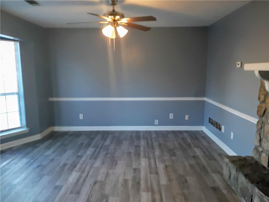 3514 Ten Oaks Court Powder Springs, GA 30127 - Photo 2 of 8 wooden floor in an empty room with a window