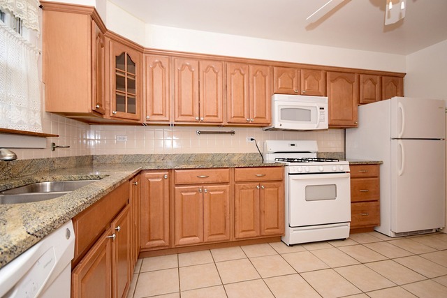 439 Shenstone Road Riverside, IL 60546 - Photo 12 of 25 a kitchen with cabinets appliances and a sink