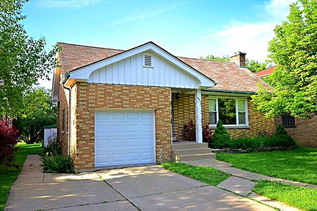 439 Shenstone Road Riverside, IL 60546 - Photo 3 of 25 a front view of a house with garage