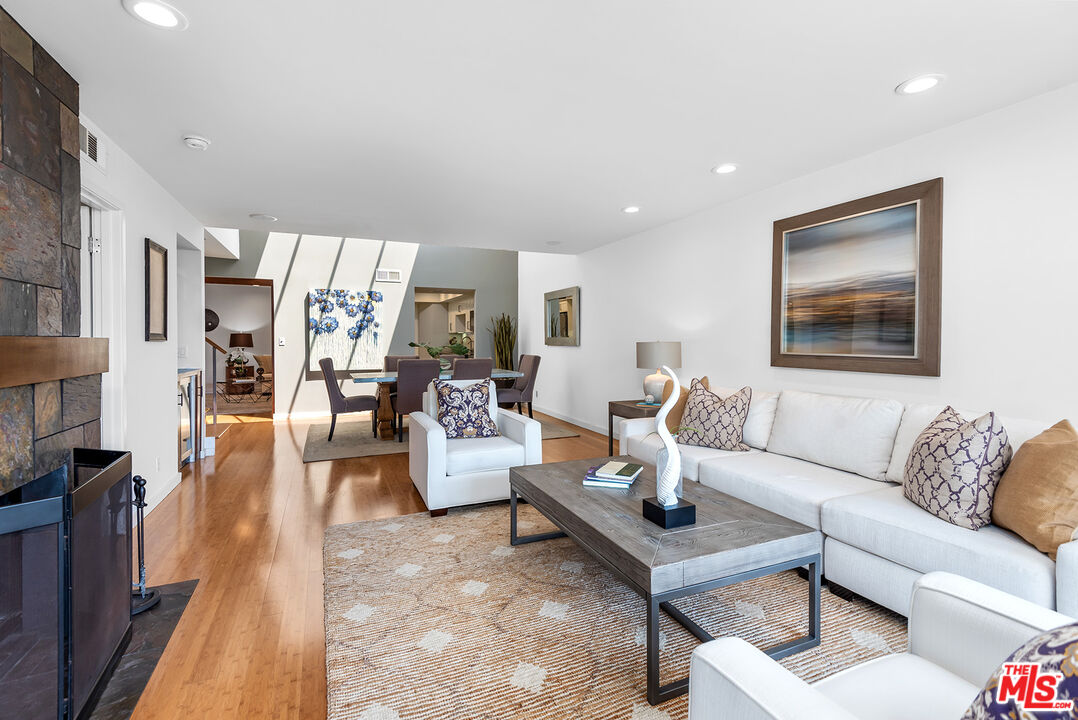 851 North Kings Road, Unit 307 West Hollywood, CA 90069 - Photo 17 of 38 a living room with furniture and a couch