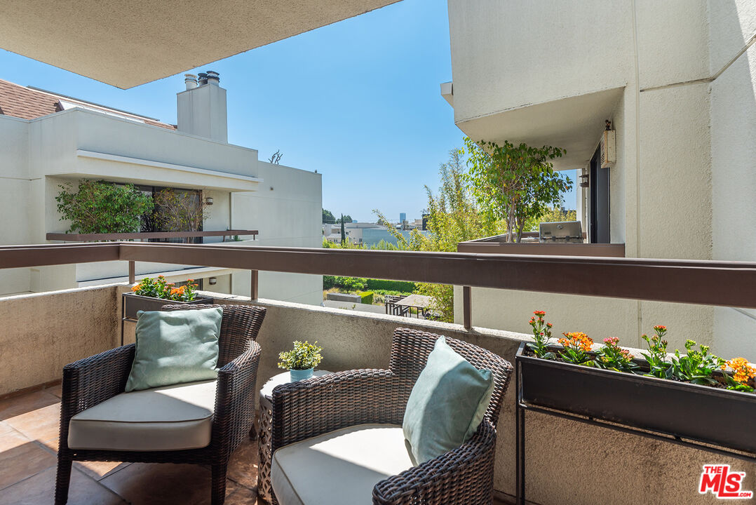 851 North Kings Road, Unit 307 West Hollywood, CA 90069 - Photo 24 of 38 a view of a dining room with furniture window and outside view