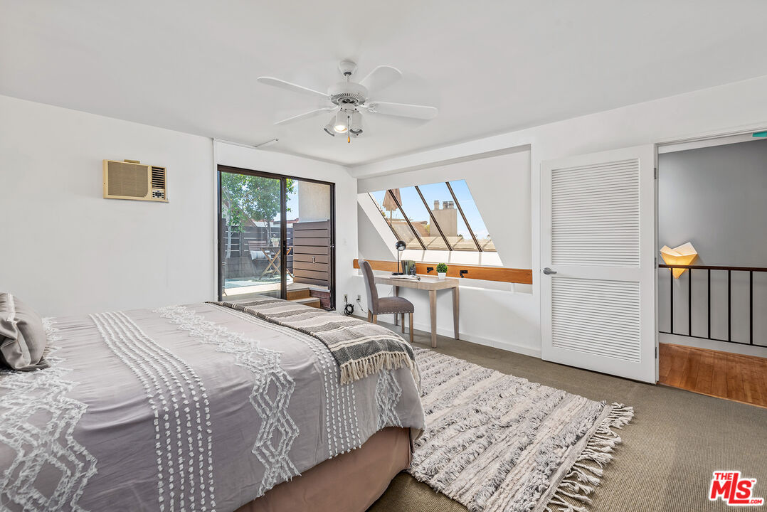 851 North Kings Road, Unit 307 West Hollywood, CA 90069 - Photo 27 of 38 a bedroom with a bed furniture and a window