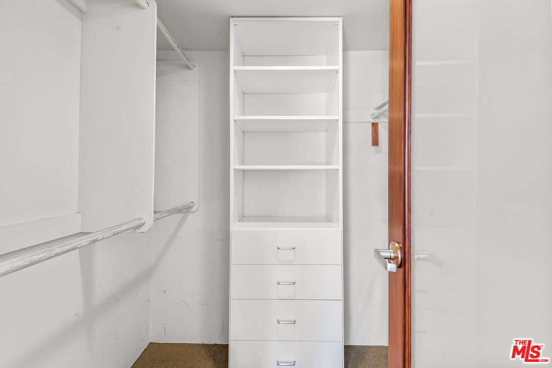 851 North Kings Road, Unit 307 West Hollywood, CA 90069 - Photo 28 of 38 a view of walk in closet with empty racks