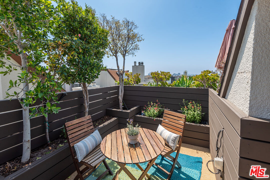 851 North Kings Road, Unit 307 West Hollywood, CA 90069 - Photo 32 of 38 a view of a chairs and table in the balcony