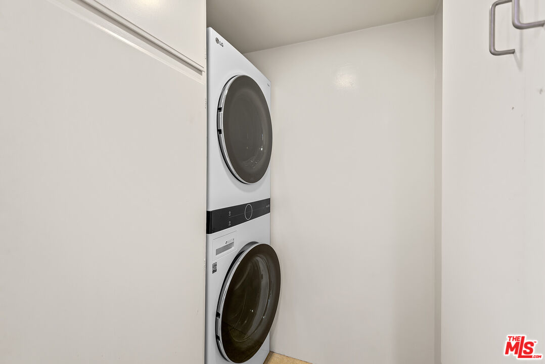 851 North Kings Road, Unit 307 West Hollywood, CA 90069 - Photo 9 of 38 a utility room with dryer and washer