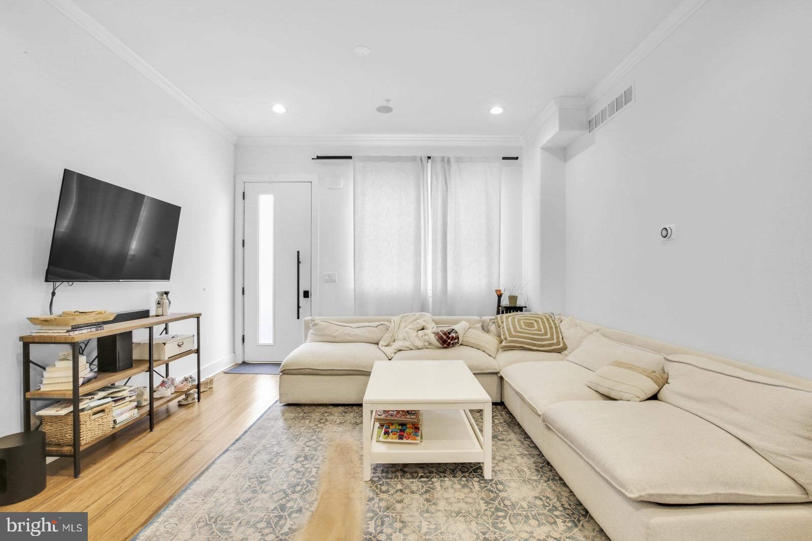 2604 Reed Street Philadelphia, PA 19146 - Photo 2 of 32 a living room with furniture and a flat screen tv