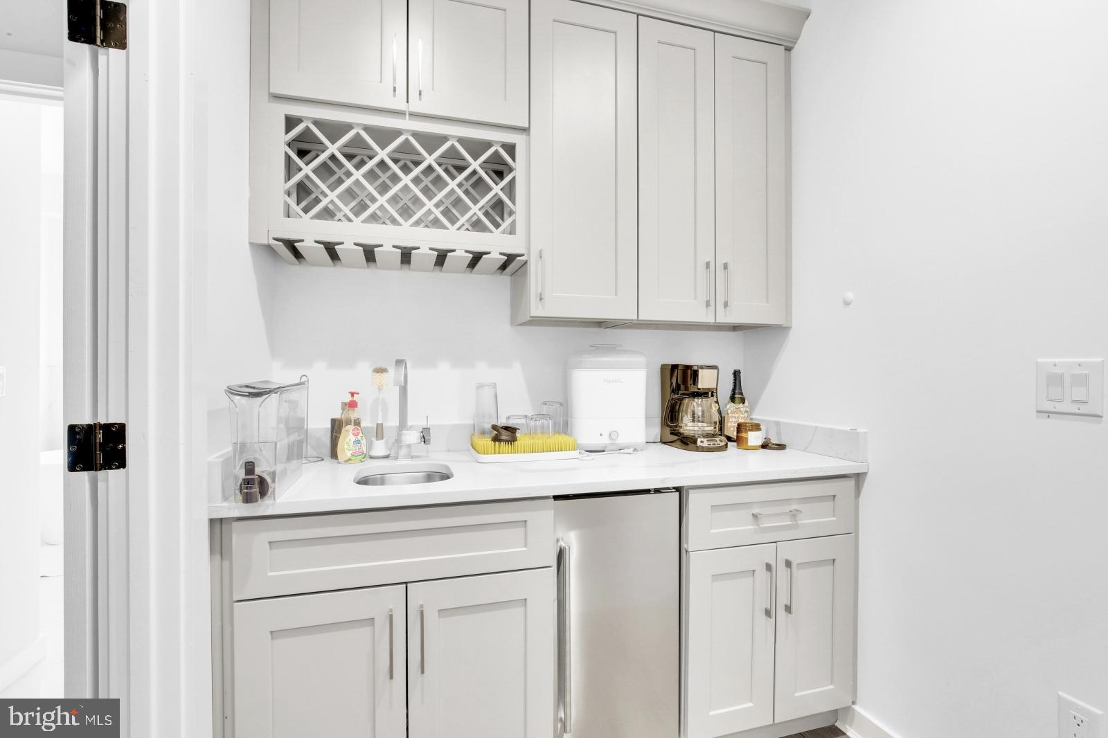 2604 Reed Street Philadelphia, PA 19146 - Photo 21 of 32 a kitchen with a sink and cabinets