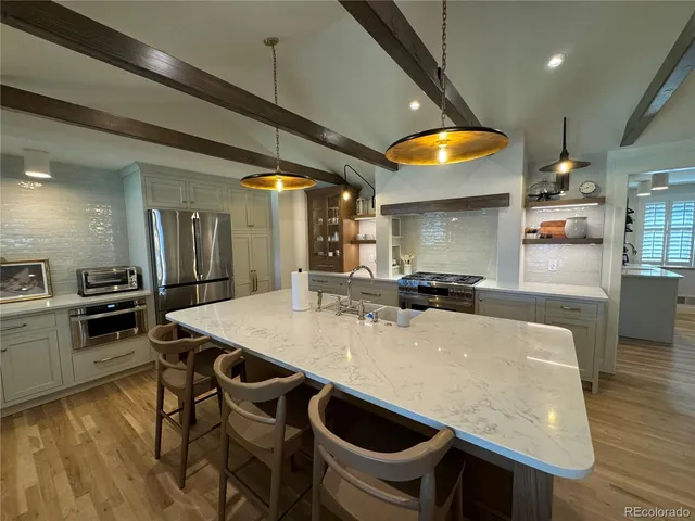 a very nice looking dining room with a table and chairs