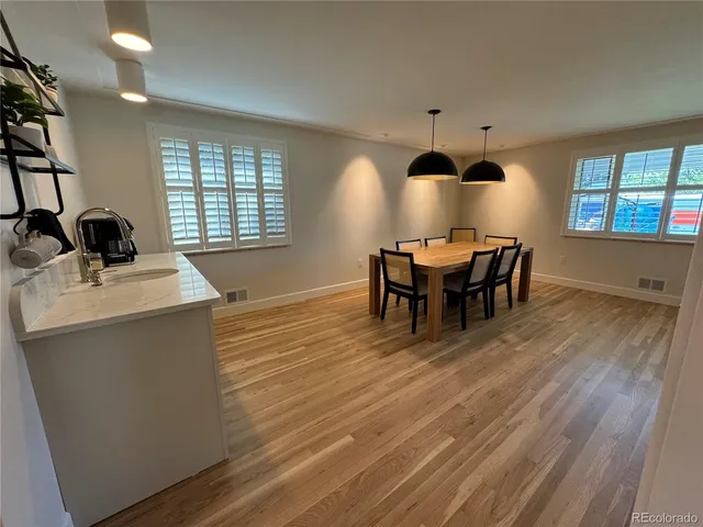 a kitchen with a sink cabinets and a window