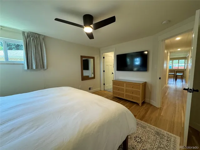 a bed room with a bed and a chandelier