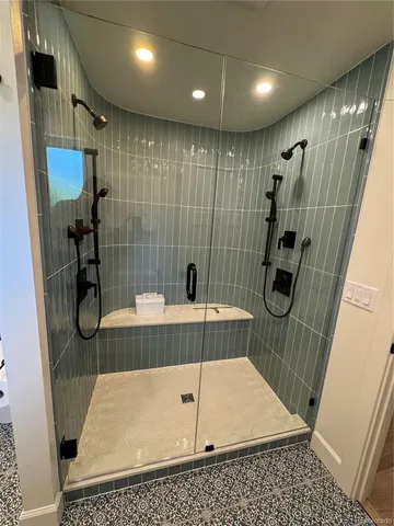 a bathroom with a tub and a shower