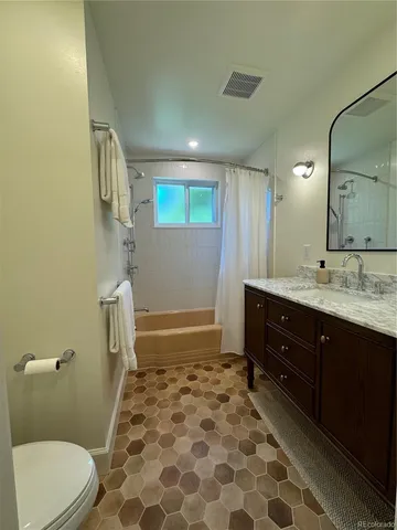 a view of a livingroom with furniture and stairs