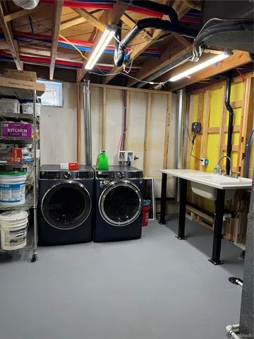 a view of a tables and chairs in patio next to a yard