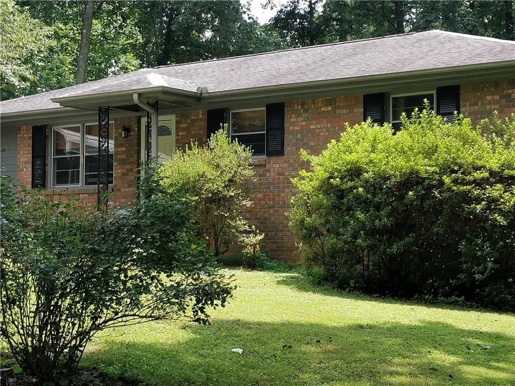 4979 Paris Avenue Powder Springs, GA 30127 - Photo 1 of 1 a view of a house with a garden