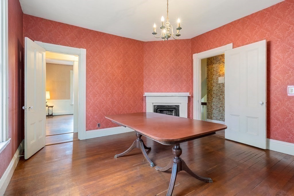 11 Gorham Avenue Brookline, MA 02445 - Photo 11 of 32 a view of a dining room with furniture and wooden floor