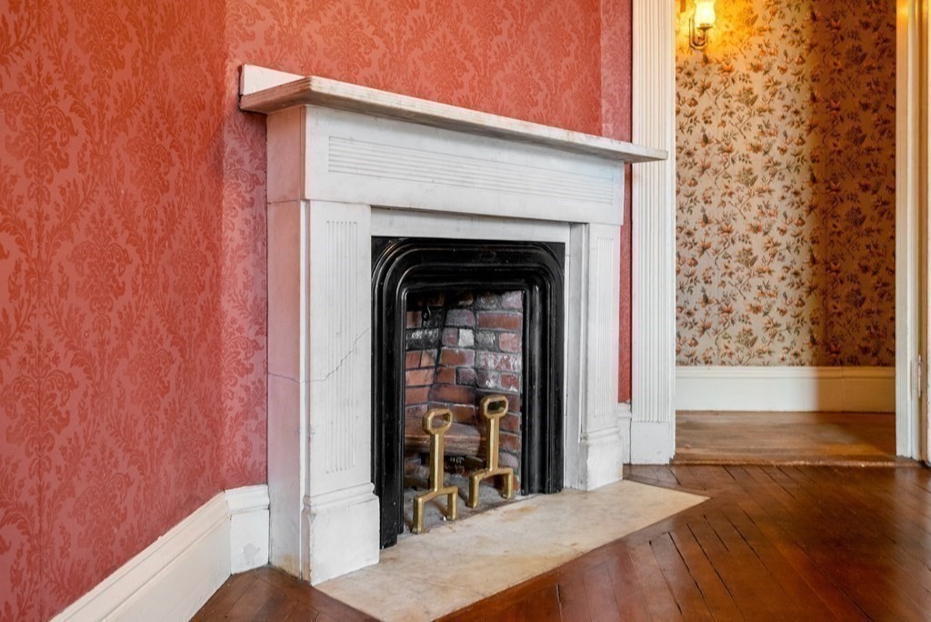 11 Gorham Avenue Brookline, MA 02445 - Photo 12 of 32 a view of a livingroom with wooden floor and a fireplace