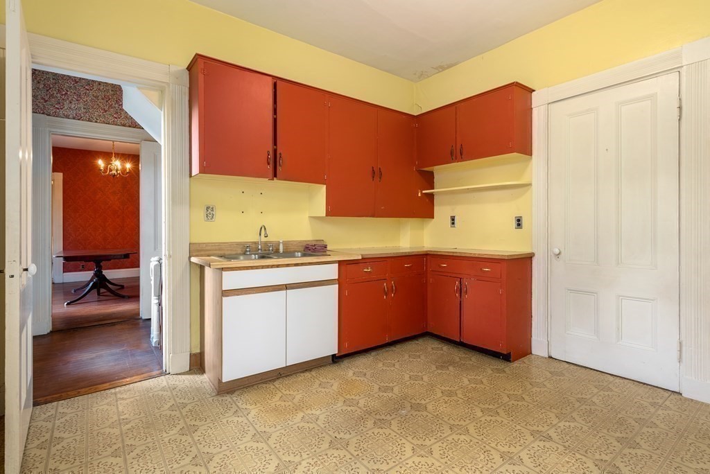 11 Gorham Avenue Brookline, MA 02445 - Photo 14 of 32 a kitchen with a refrigerator and a stove