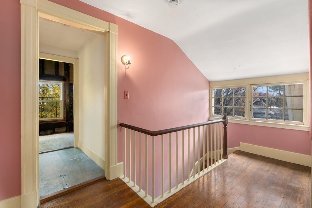 11 Gorham Avenue Brookline, MA 02445 - Photo 20 of 32 a view of a hallway with wooden floor and windows