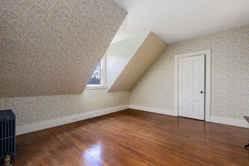 11 Gorham Avenue Brookline, MA 02445 - Photo 21 of 32 a view of an empty room with wooden floor