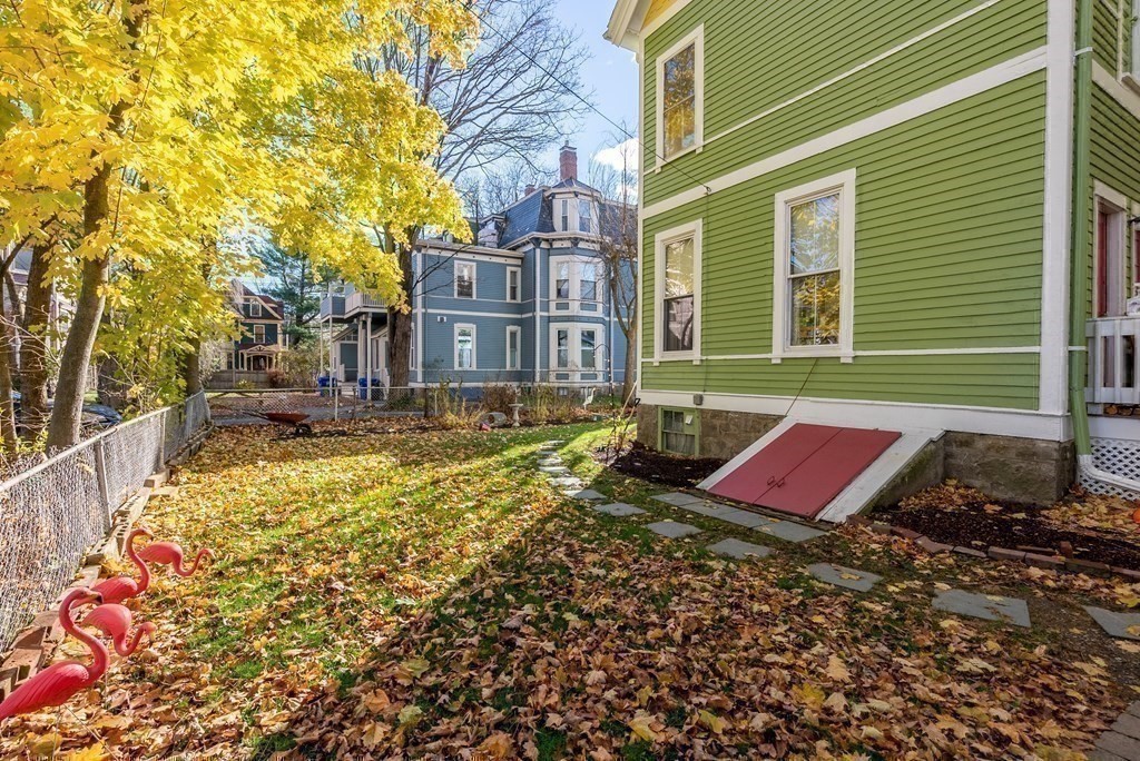 11 Gorham Avenue Brookline, MA 02445 - Photo 25 of 32 a view of a brick house with a yard