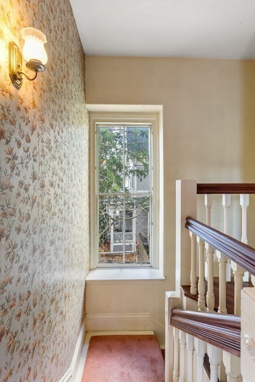 11 Gorham Avenue Brookline, MA 02445 - Photo 4 of 32 a view of a porch with a wooden floor