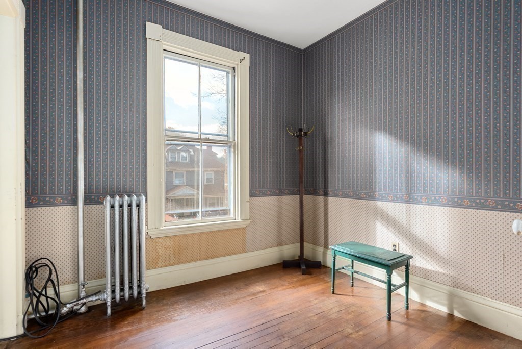 11 Gorham Avenue Brookline, MA 02445 - Photo 7 of 32 a living room with furniture and a window
