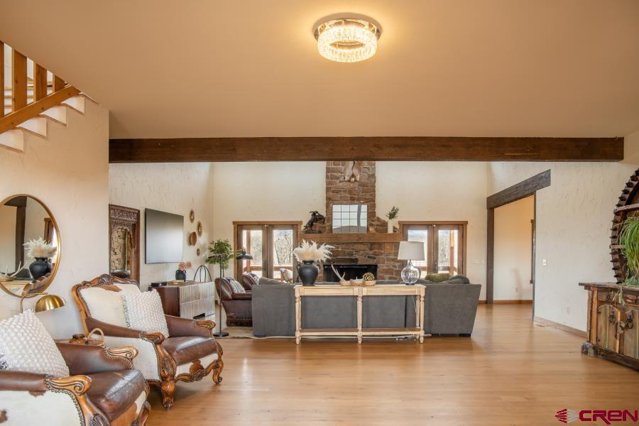 66961 Solar Road Montrose, CO 81403 - Photo 12 of 44 a view of a livingroom with furniture and a flat screen tv