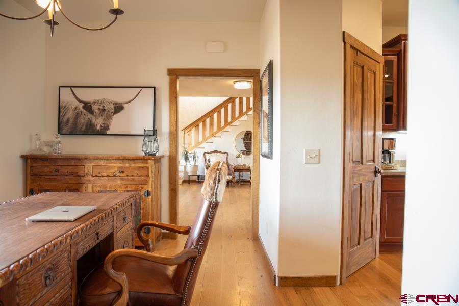66961 Solar Road Montrose, CO 81403 - Photo 20 of 44 a view of a hallway with workspace