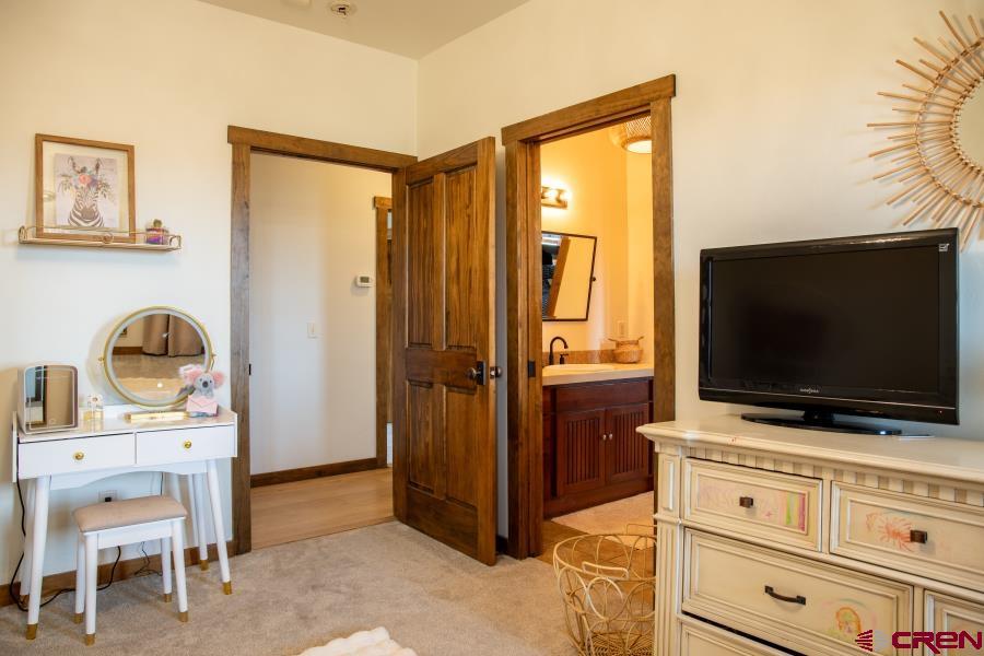 66961 Solar Road Montrose, CO 81403 - Photo 30 of 44 a view of living room with furniture and flat screen tv