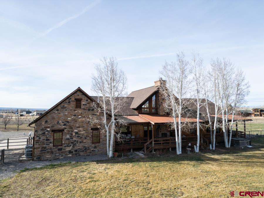 66961 Solar Road Montrose, CO 81403 - Photo 31 of 44 a view of a house with a backyard