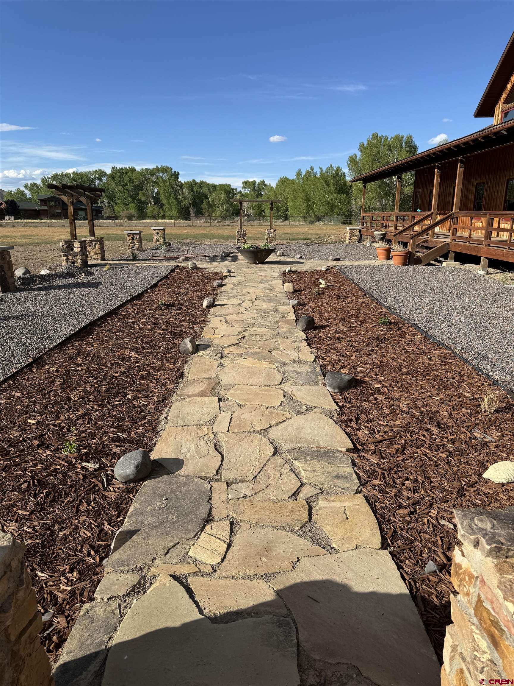 66961 Solar Road Montrose, CO 81403 - Photo 4 of 44 a view of a road with an ocean view