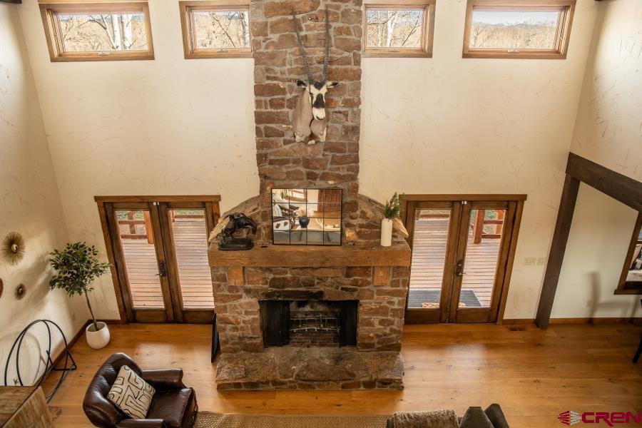 66961 Solar Road Montrose, CO 81403 - Photo 42 of 44 a living room with furniture and a fireplace