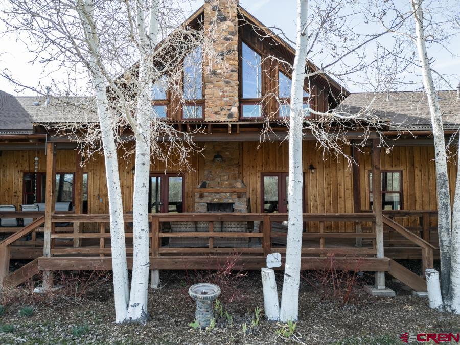 66961 Solar Road Montrose, CO 81403 - Photo 44 of 44 a view of a house with a small yard and wooden fence