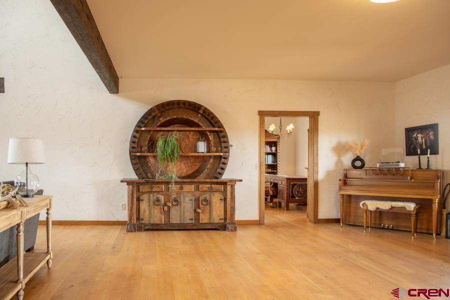 66961 Solar Road Montrose, CO 81403 - Photo 5 of 44 a view of a livingroom with furniture and a fireplace