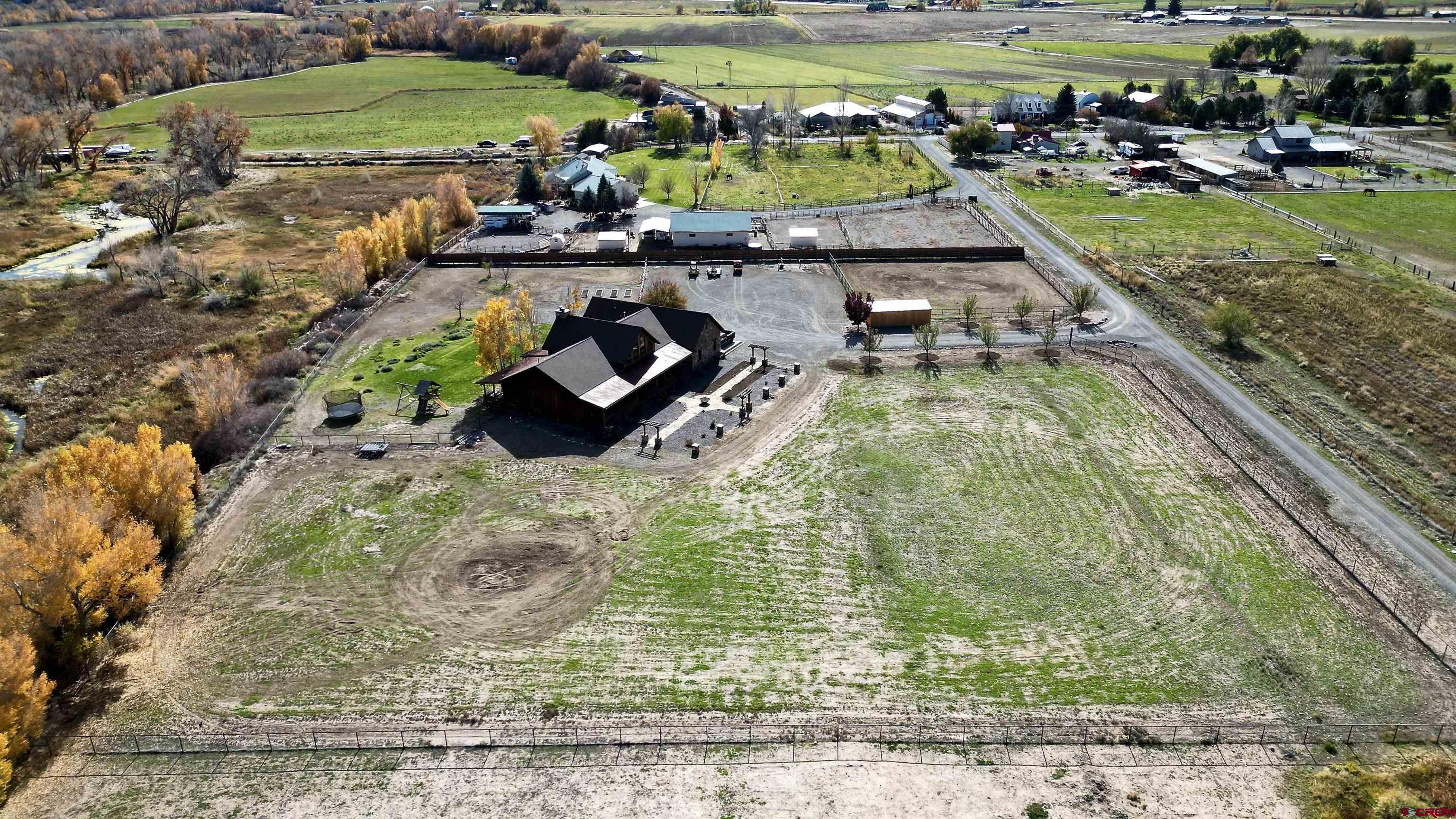 66961 Solar Road Montrose, CO 81403 - Photo 9 of 44 a view of a swimming pool with a yard and plants