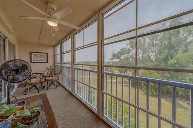 a view of a chairs and table in a balcony