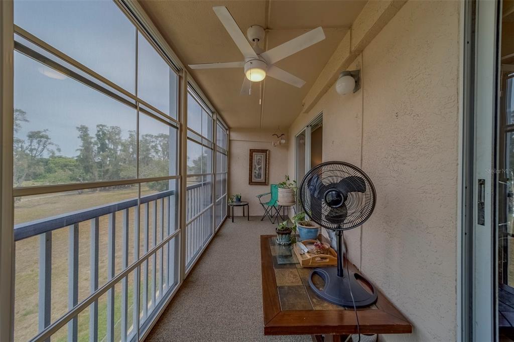 9510 Harbor Greens Way, Unit 407 Seminole, FL 33776 - Photo 29 of 41 a view of a hallway with wooden floor and a sink