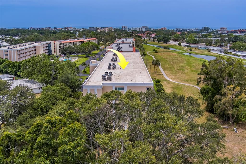 9510 Harbor Greens Way, Unit 407 Seminole, FL 33776 - Photo 36 of 41 an aerial view of residential houses with outdoor space and river