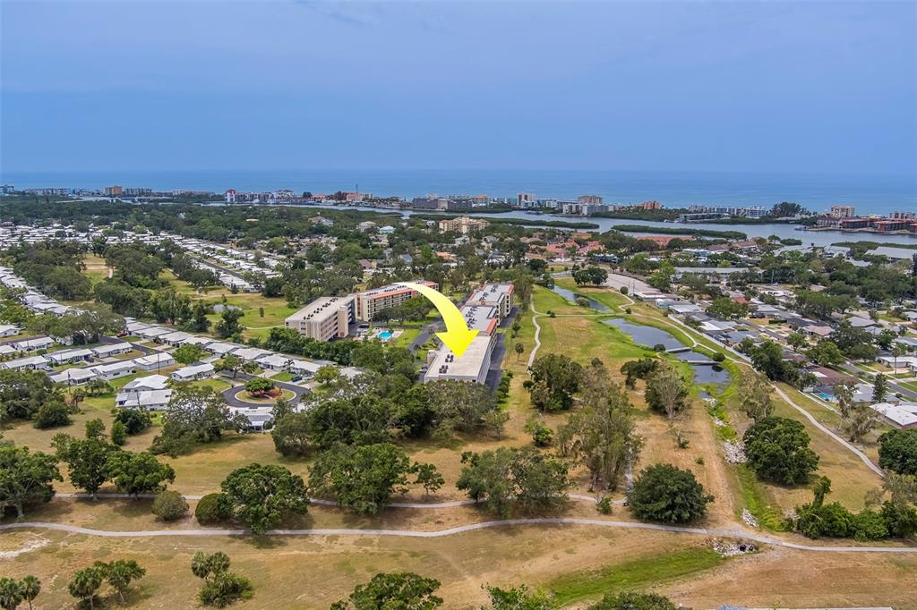 9510 Harbor Greens Way, Unit 407 Seminole, FL 33776 - Photo 39 of 41 an aerial view of a city with lots of residential buildings
