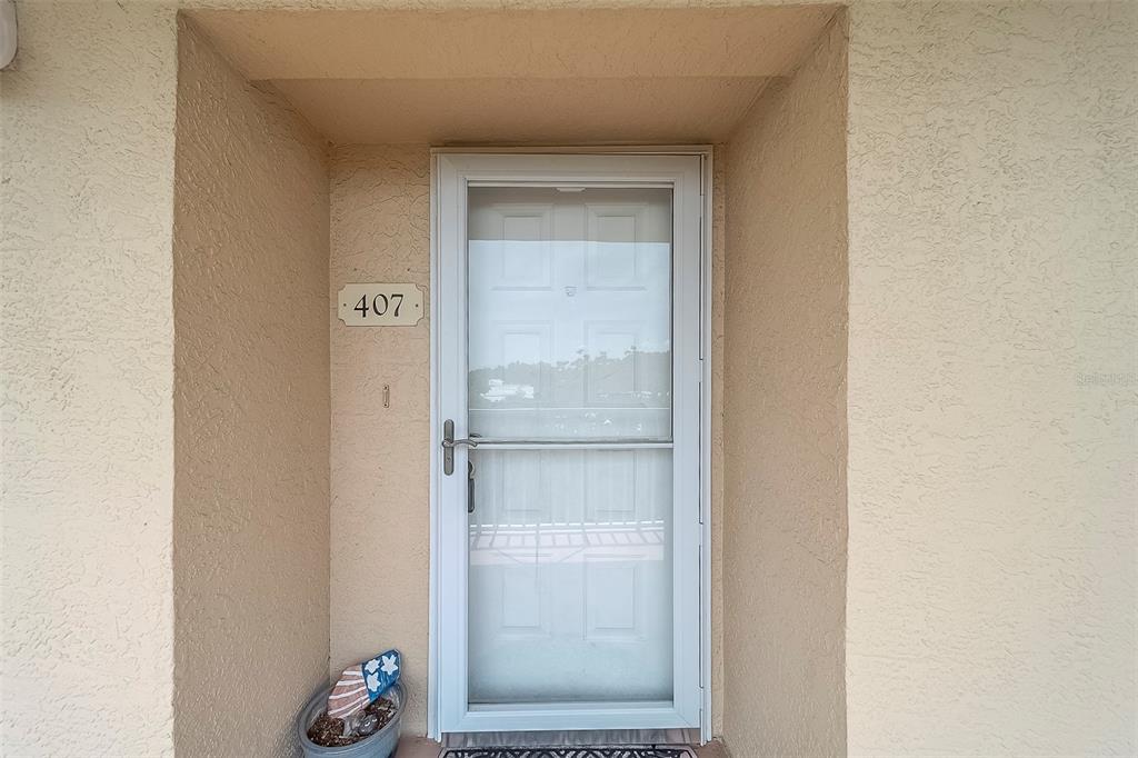 9510 Harbor Greens Way, Unit 407 Seminole, FL 33776 - Photo 4 of 41 a view of front door
