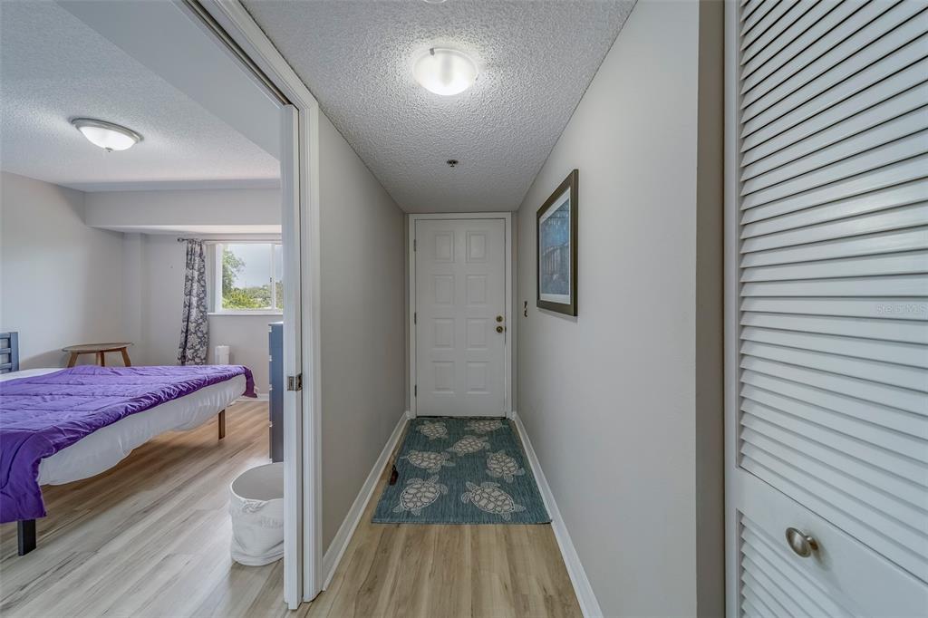 9510 Harbor Greens Way, Unit 407 Seminole, FL 33776 - Photo 5 of 41 a room with a bed and a window