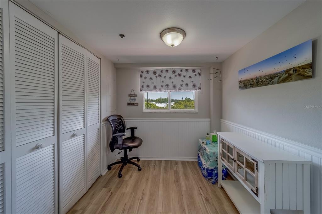 9510 Harbor Greens Way, Unit 407 Seminole, FL 33776 - Photo 9 of 41 a view of a workspace with furniture and a window
