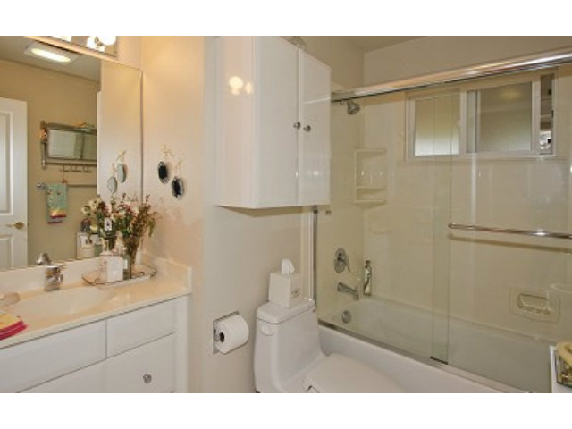 1635 Springer Road Mountain View, CA 94040 - Photo 5 of 8 a bathroom with a shower sink and mirror