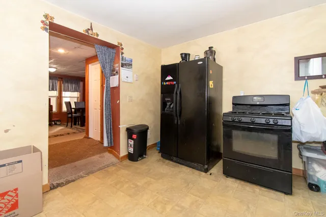 a kitchen with stainless steel appliances granite countertop a refrigerator and a stove