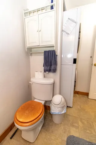 a white toilet sitting next to a bathroom sink