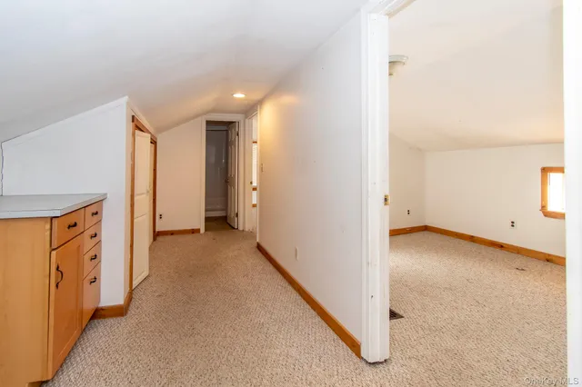 a view of a hallway with closet