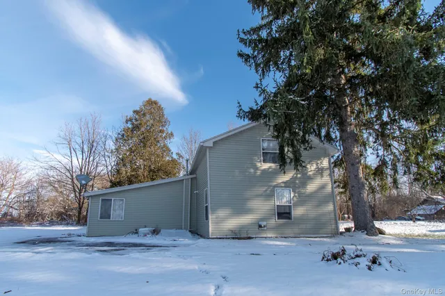 a view of a house with a tree
