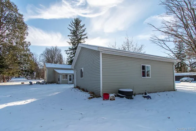 a view of a house with a backyard